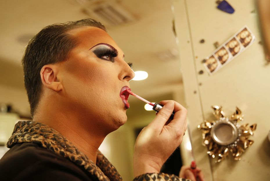 James Love applies his makeup before performing as "Cassie Nova" at Sue Ellen's in Dallas in...