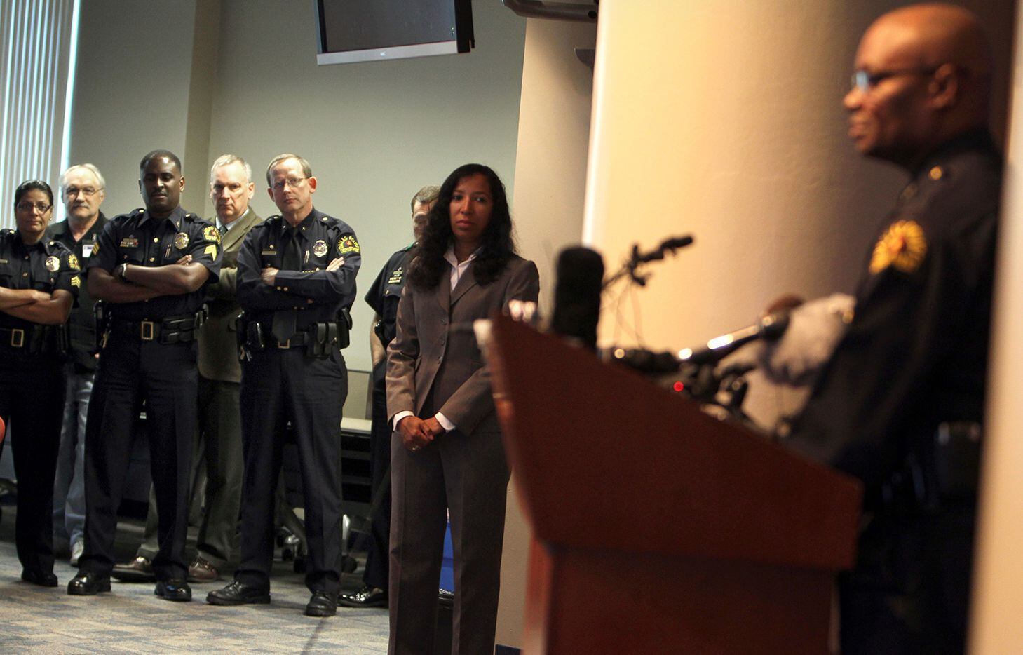 Police officers listen as new Dallas Police Chief David Brown addresses the media at Jack...