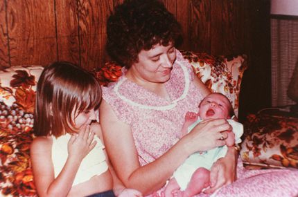 Betty Gore holds her daughter Bethany while Lisa sits next to her in 1979, a year before her...