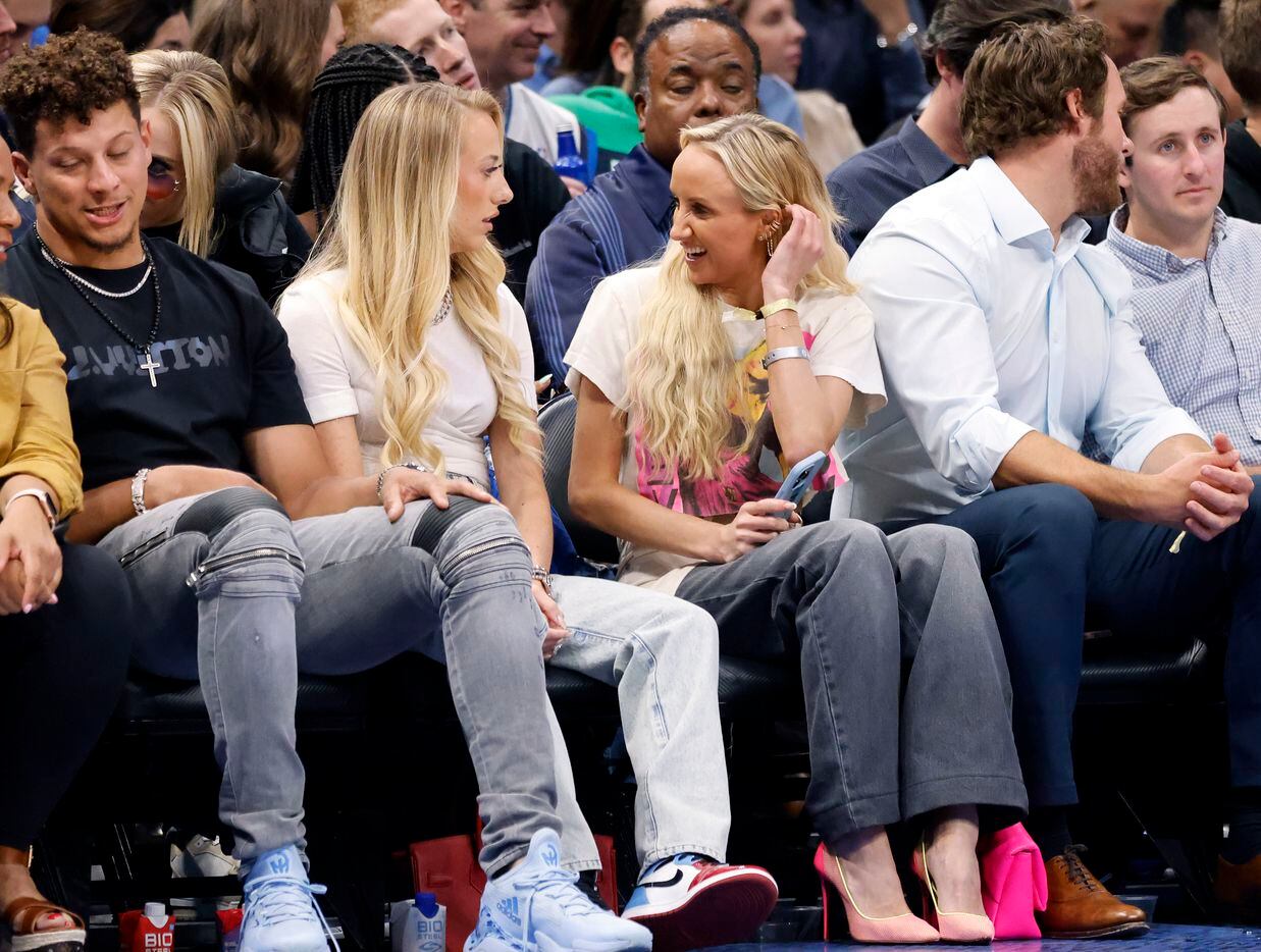 Olympic gold medal gymnast Nastia Liukin (center, right) visits with Brittany Matthews, wife...