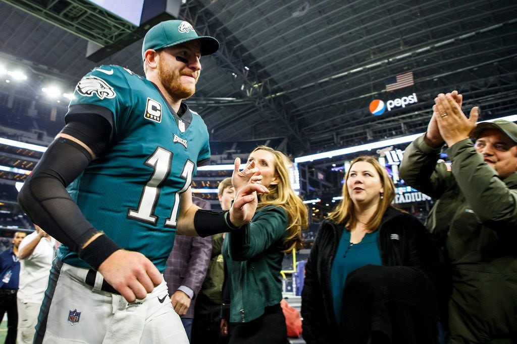 Philadelphia Eagles quarterback Carson Wentz (11) celebrates with fans as he leaves the field following a victory over the Dallas Cowboys an NFL football game at AT&T Stadium on Sunday, Nov. 19, 2017, in Arlington, Texas. The Eagles won the game 37-9. (Smiley N. Pool/The Dallas Morning News)