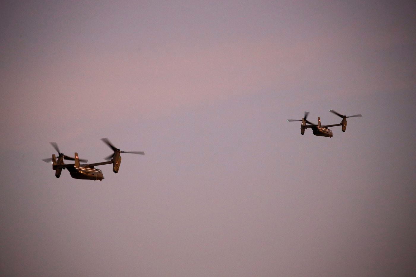 The Marine Helicopter Squadron One (HMX-1) including two escort V-22 Ospreys departs Love...