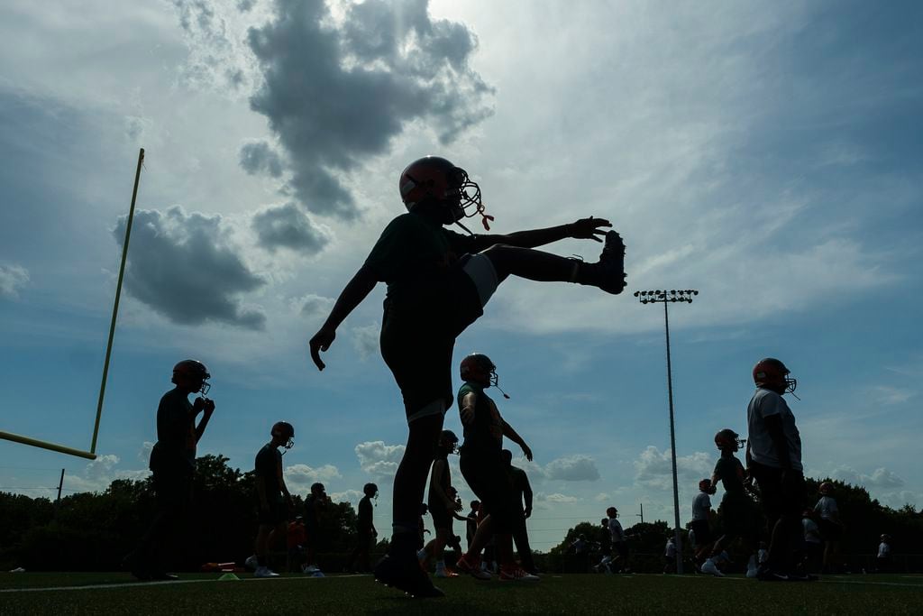 Garland Naaman Forest freshman football players practice at the school on Friday, Aug. 9, 2019, in Garland, Texas.  The teamÕs coaches delayed practice Friday by an hour an a half due to the heat index earlier in the afternoon.
