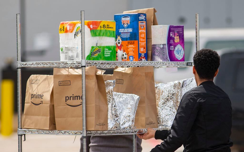 Amazon Prime workers fulfill orders at the Amazon Flex center on Maple Avenue on Monday.