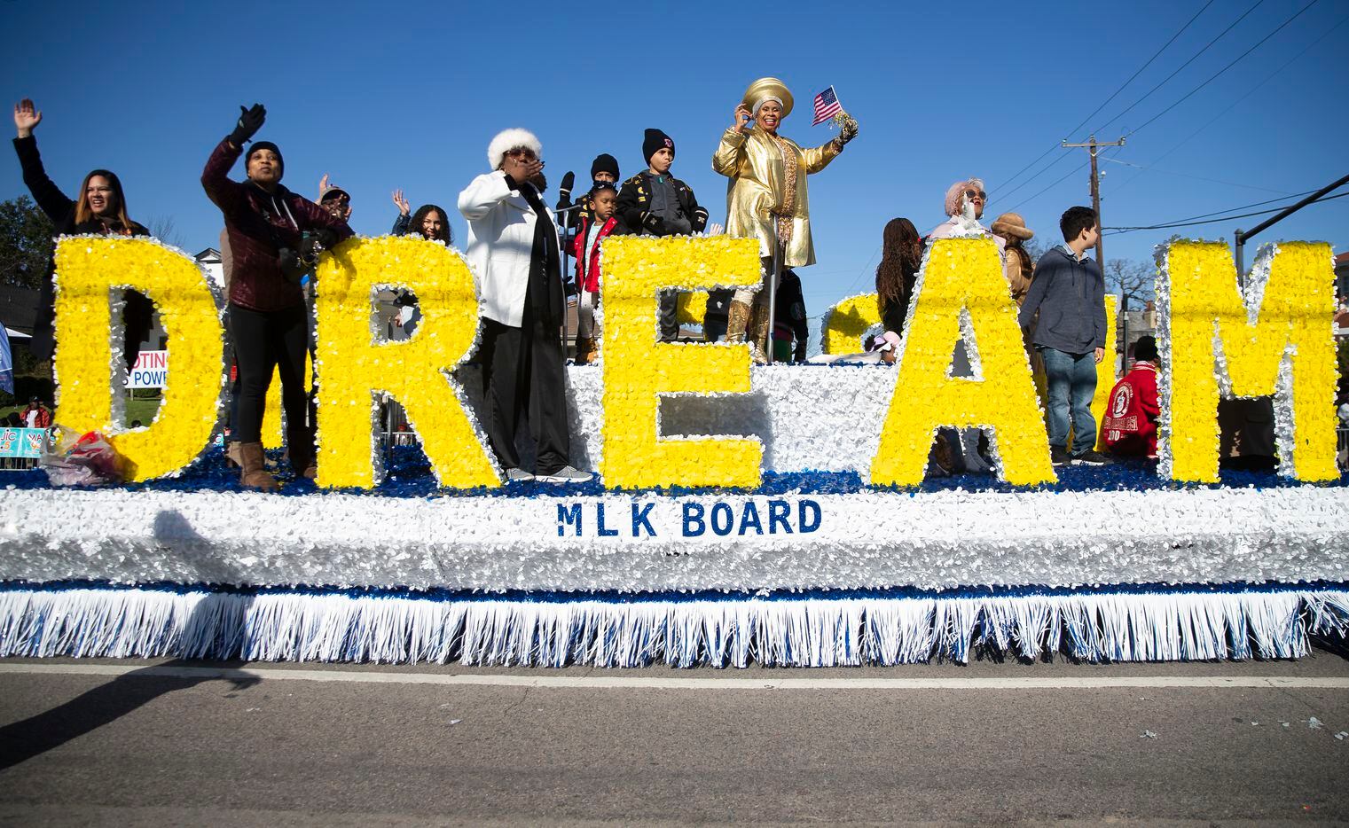 The MLK Board waves as they make their way down Martin Luther King Jr. Blvd during the 38th annual MLK Parade on Jan. 20, 2020 in Dallas. (Juan Figueroa/ The Dallas Morning News)