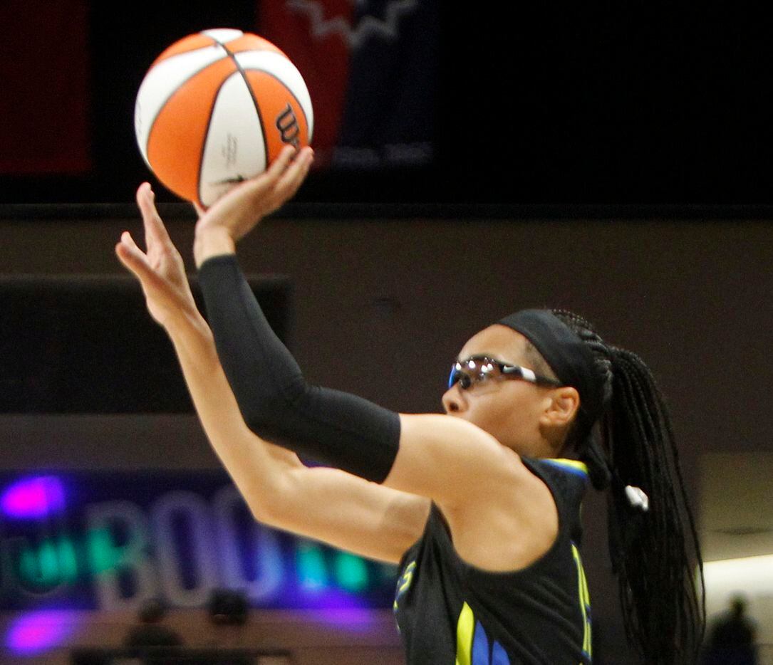 Dallas Wings guard Allisha Gray (15) shoots a jump shot during first half action against the...