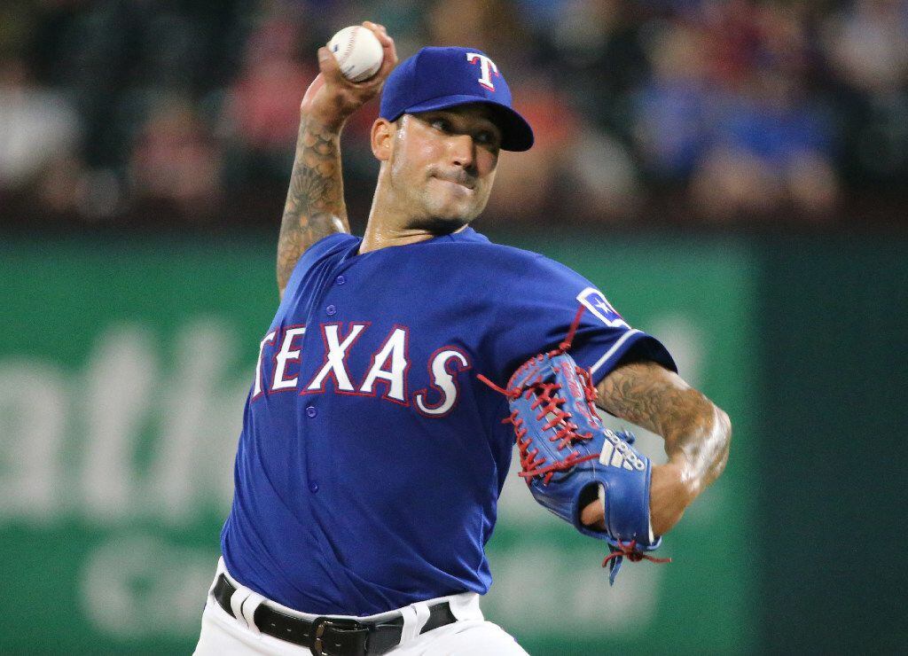 FILE - Rangers relief pitcher Matt Bush (51) is pictured during a game between the Mariners...