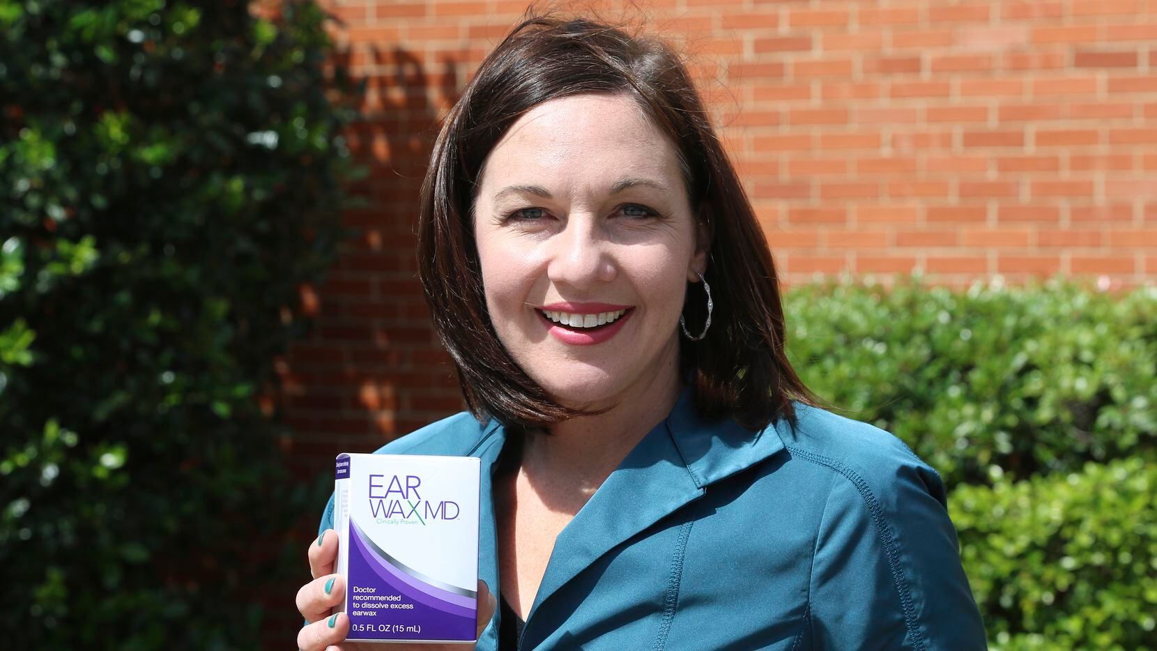 Elyse Stoltz Dickerson, a CEO and founder of Eosera takes a photo with her new earwax...