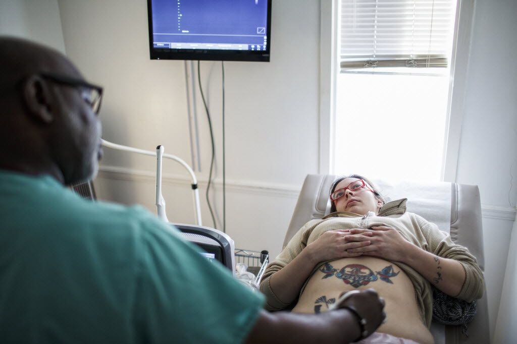 Dr. Willie Parker performs an ultrasound on Ashley Garza prior to her abortion at...