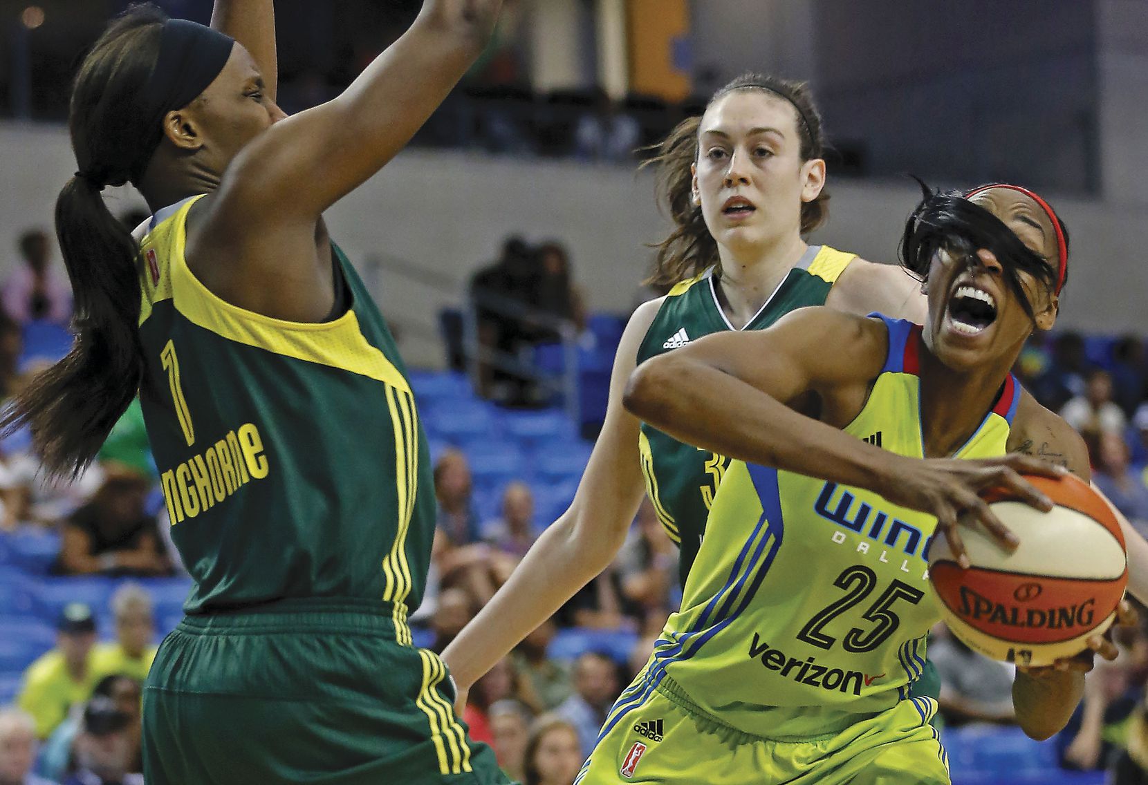 Dallas Wings forward Glory Johnson (right) tries to get around Seattle Storm forward Crystal Langhorne during a WNBA game at College Park Center in Arlington.