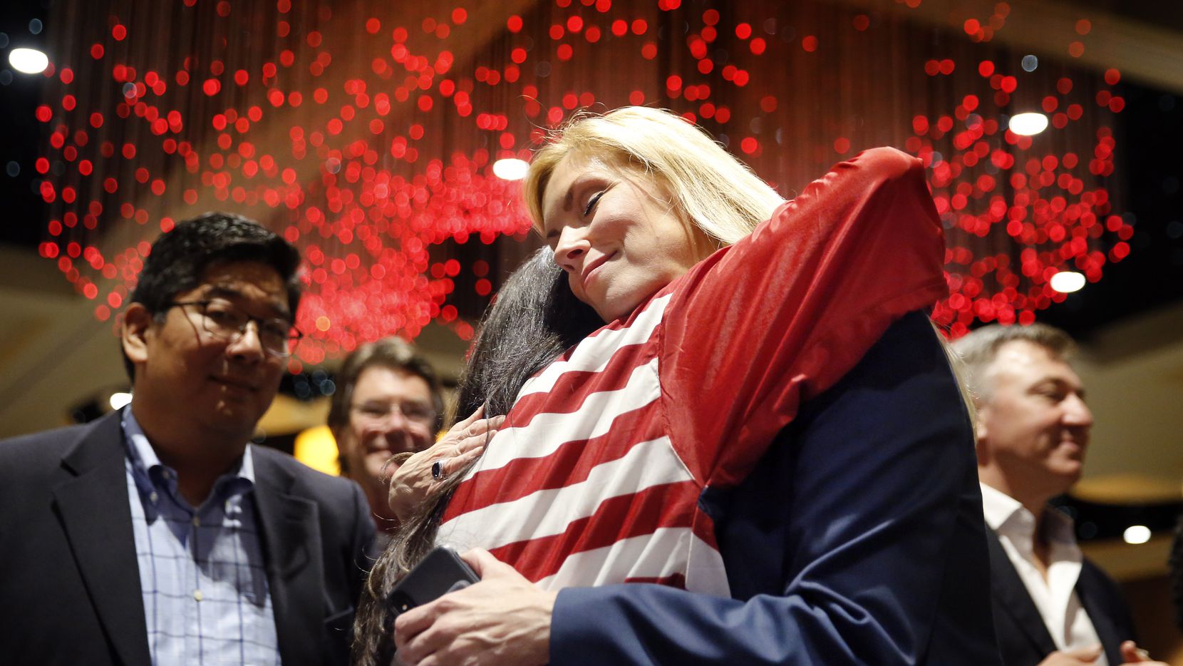 Republican Beth Van Duyne receives a hug from precinct chair Anne Gebhart after speaking to...