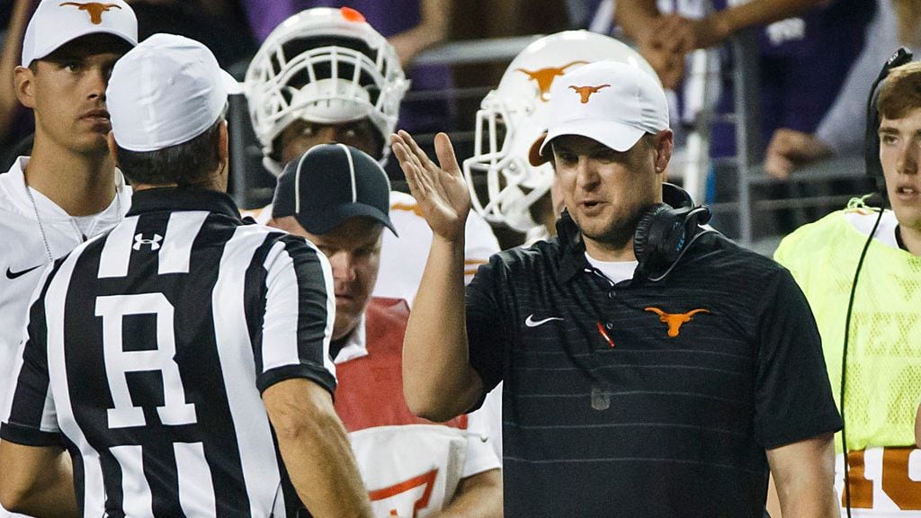 Texas head coach Tom Herman argues with referee Brad Van Vark during the second half of an...