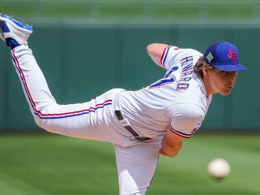 Texas Rangers pitcher Spencer Howard delivers during the second inning of a spring training...