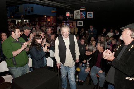 Guy Clark received a standing ovation as he made his way to the stage during Poor David's...