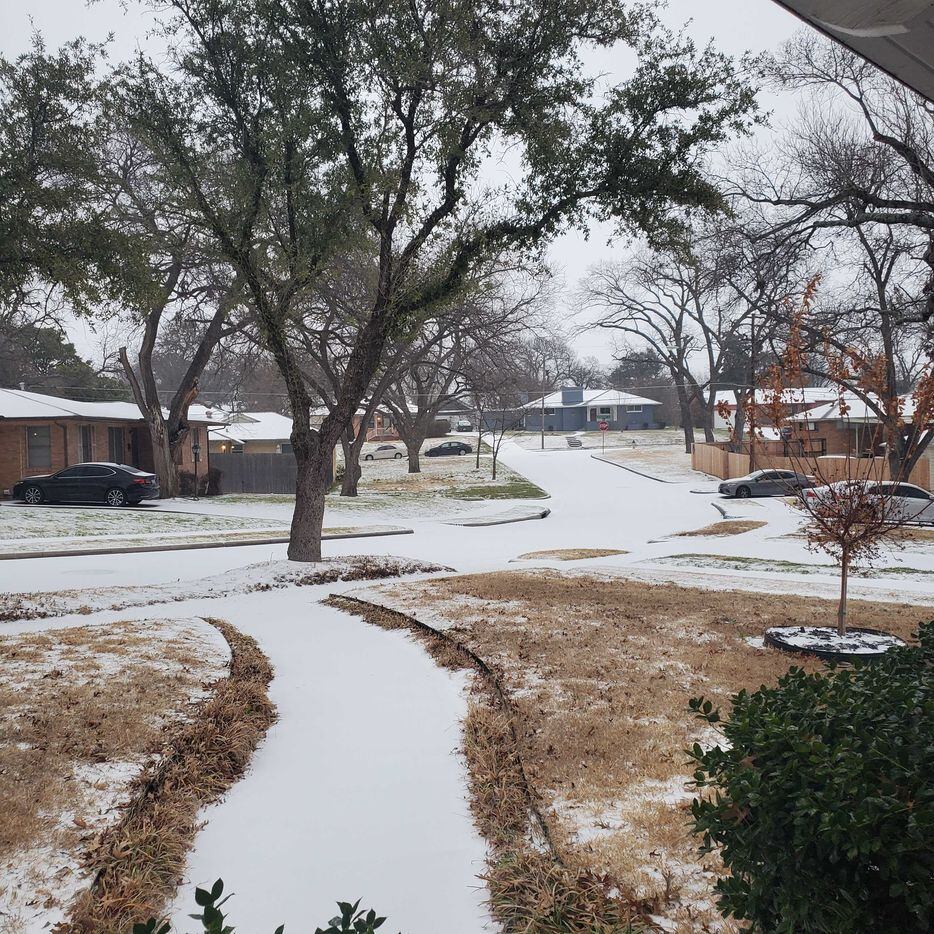 Ice covers roads and sidewalks in this Oak Cliff neighborhood on Tuesday, Jan. 31, 2023, in...