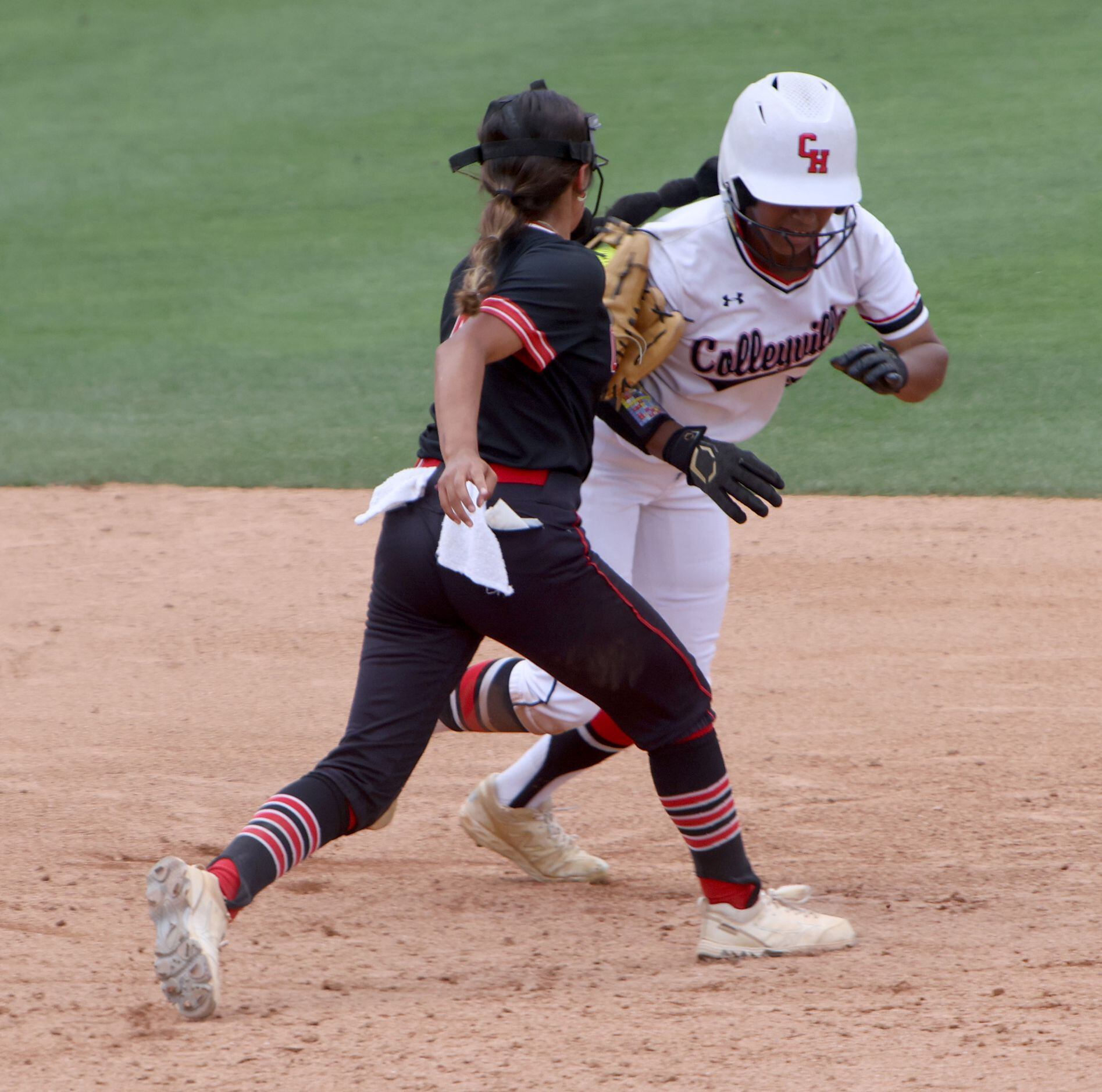 Colleyville Heritage baserunner DeNae Dickson (9), right, is tagged out by Comal Canyon...