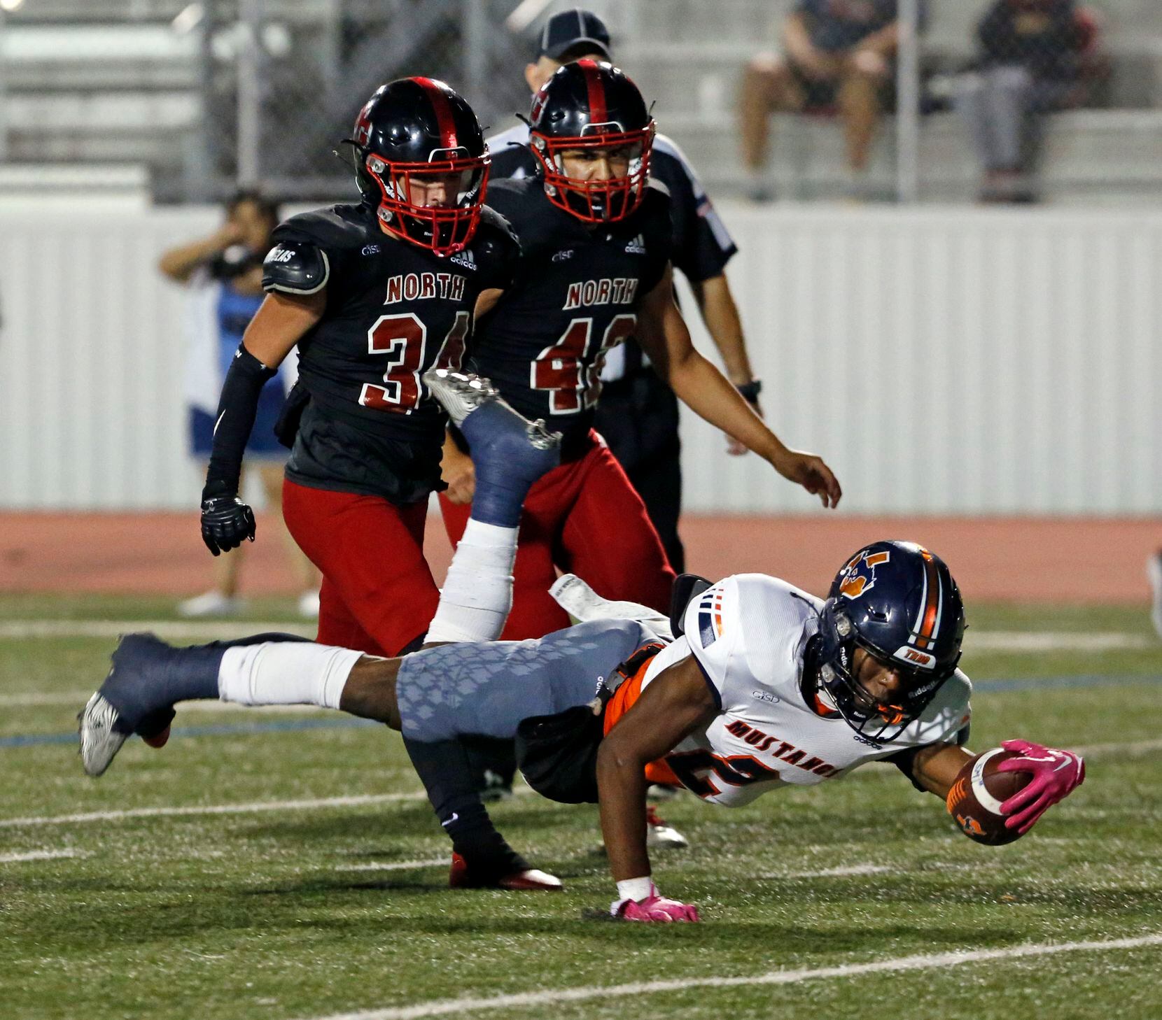 Sachse RB Pope Akanna (2) horizontally dives for a touchdown during the first half of a high...