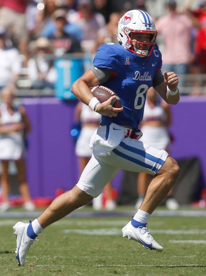 SMU quarterback Tanner Mordecai (8) rushes for a first down during 4th quarter action...