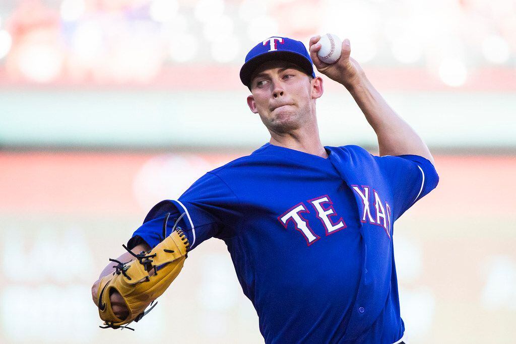Texas Rangers starting pitcher Mike Minor pitches during the first inning against the San...