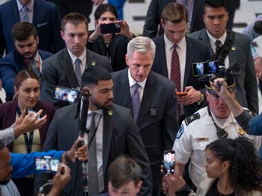 Speaker of the House Kevin McCarthy, R-Calif., leaves the chamber after passage of a crucial...