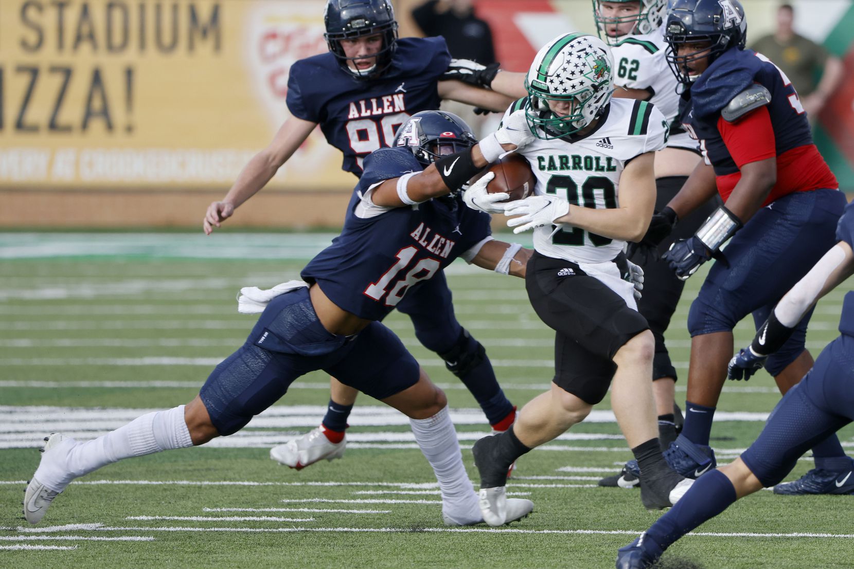 Allen’s Malakai Thornton (18) is called for a facemask penalty against Southlake Carroll’s James Lehman (20) during the first half of a Class 6A Division I Region I final high school football game in Denton, Texas on Saturday, Dec. 4, 2021. (Michael Ainsworth/Special Contributor)