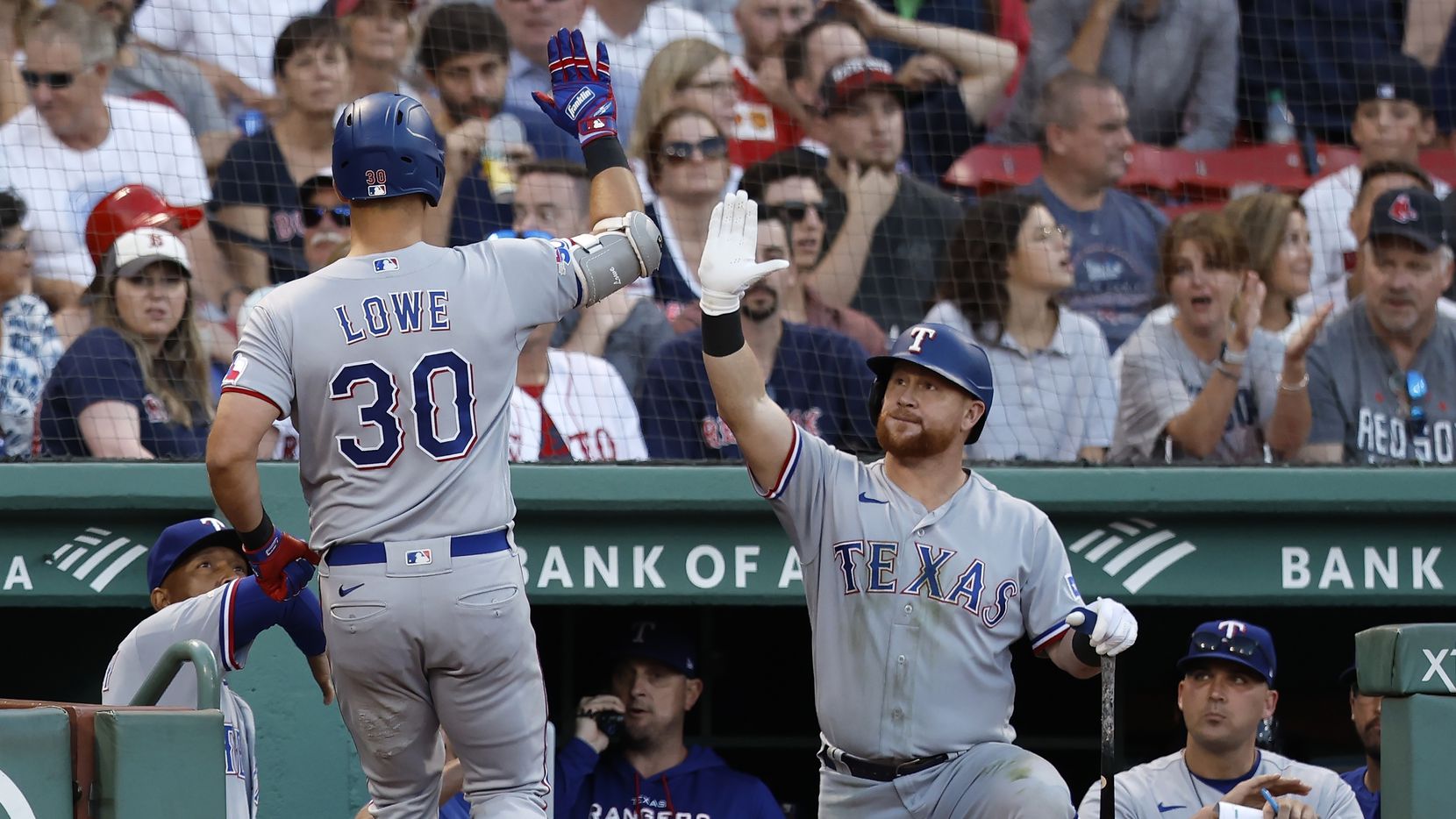 Texas Rangers' Nathaniel Lowe (30) celebrates his solo home run during the eighth inning of...