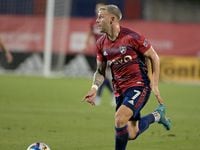FC Dallas forward Paul Arriola (7) dribbles the ball upfield in the second half during a MLS...