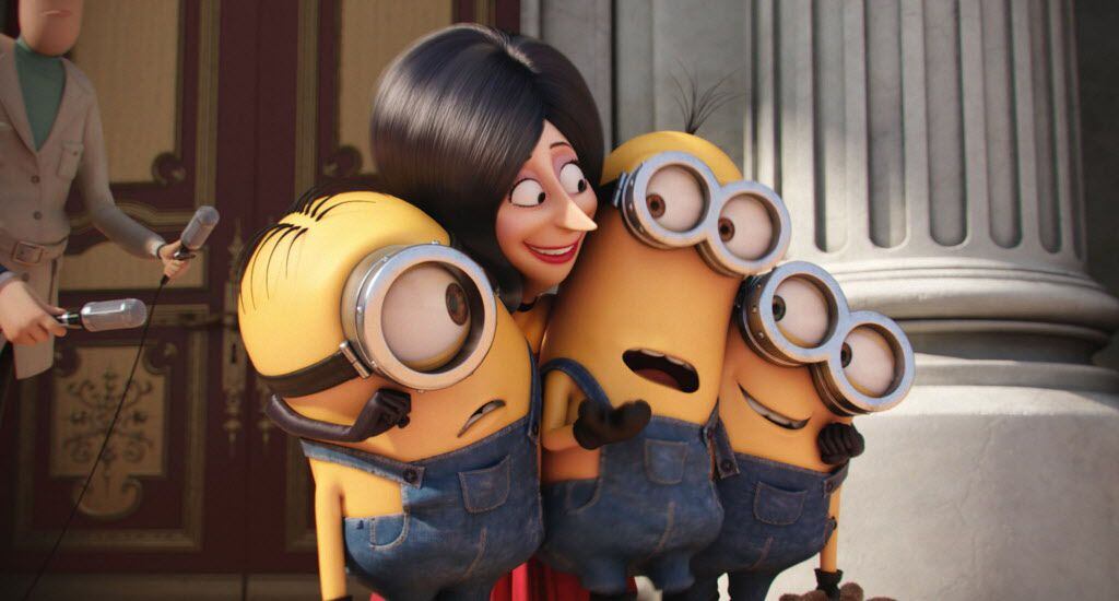 In this image released by Universal Pictures, Scarlet Overkill, voiced by Sandra Bullock, second left, appears with minions Stuart, left, Kevin and Bob, right, in a scene from the animated feature, Minions.