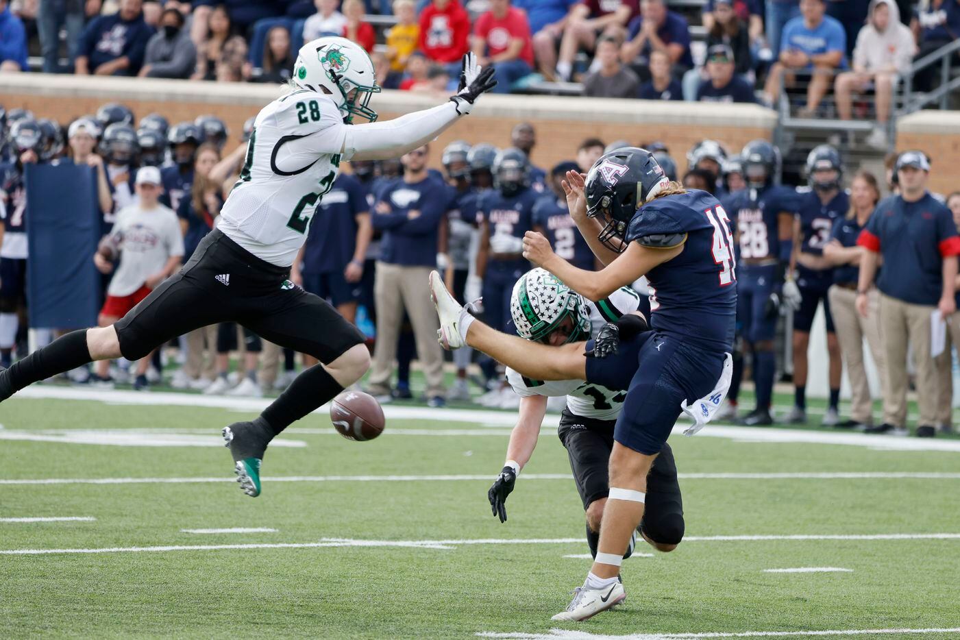 Southlake’s Aaron Scherp (28) and Logan Anderson pressure Allen punter Carter Colaluca (46) during the first half of a Class 6A Division I Region I final high school football game in Denton, Texas on Saturday, Dec. 4, 2021. (Michael Ainsworth/Special Contributor)