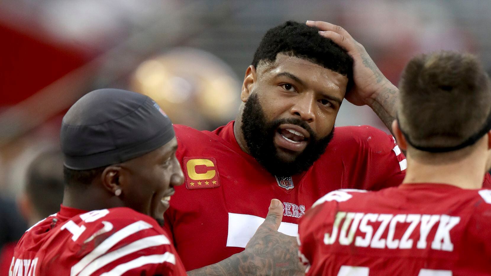 San Francisco 49ers offensive tackle Trent Williams (71) talks with San Francisco 49ers wide...