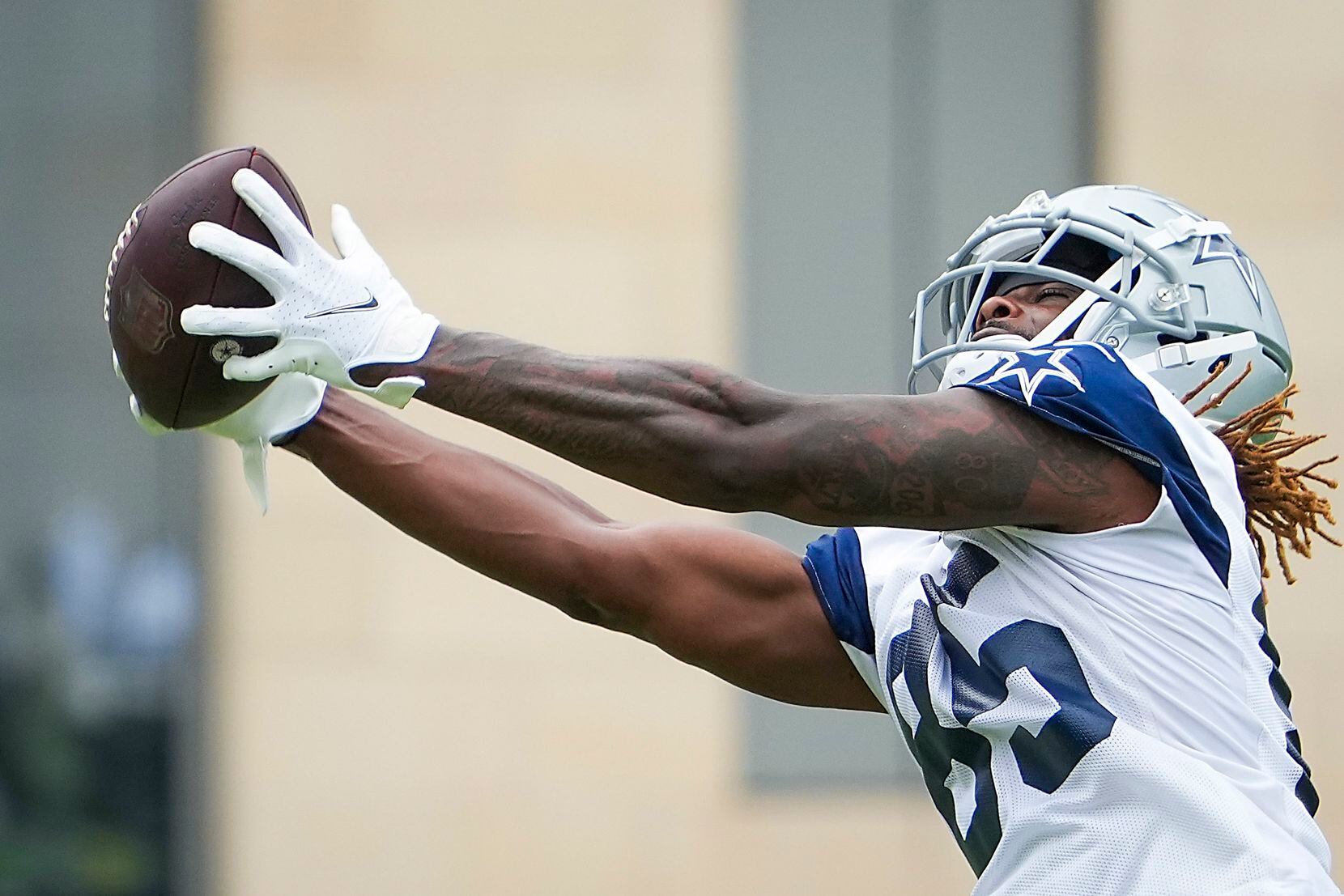 Dallas Cowboys wide receiver Noah Brown (85) reaches for a pass during a minicamp practice...