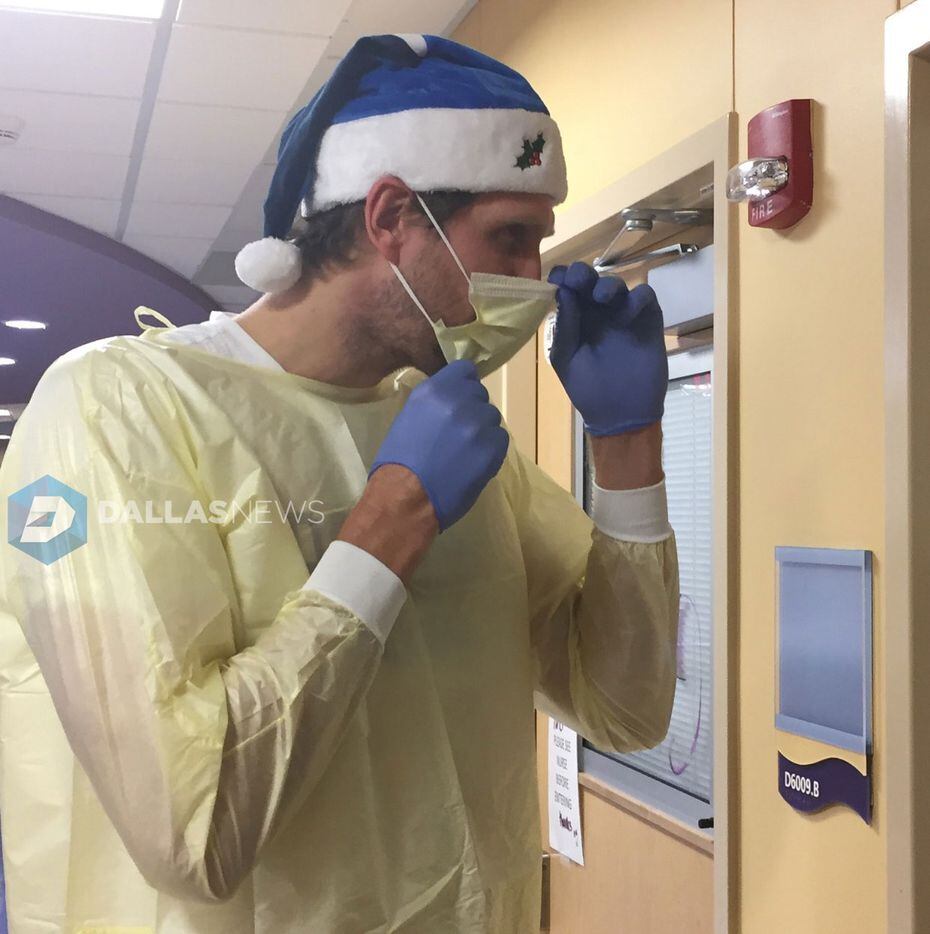 Dirk Nowitzki prepares to enter a patient's room at Children's Medical Center Dallas.