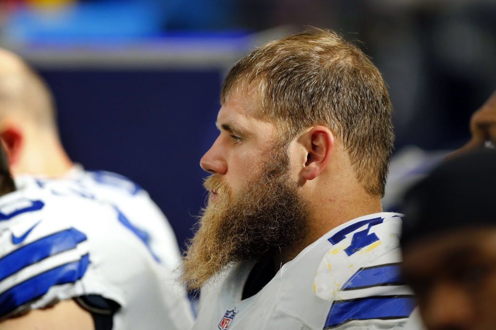 Dallas Cowboys center Travis Frederick is seen on the bench in the second half against the...