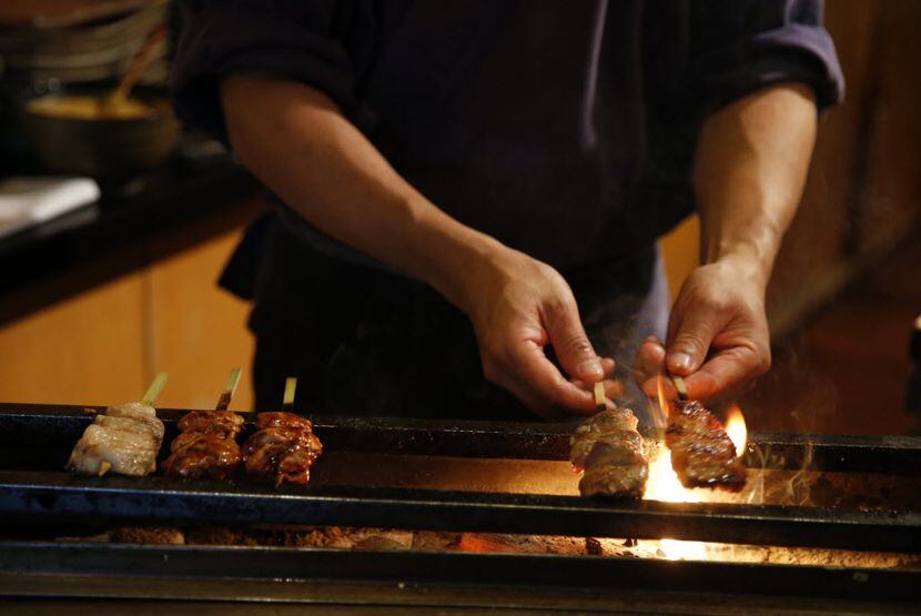 Teppo chef-owner Masayuki Otaka grills yakitori at Teppo. 