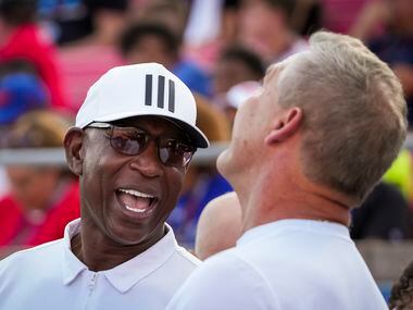 Members of the famed SMU Pony Express backfield, Eric Dickerson (left) and Craig James share...