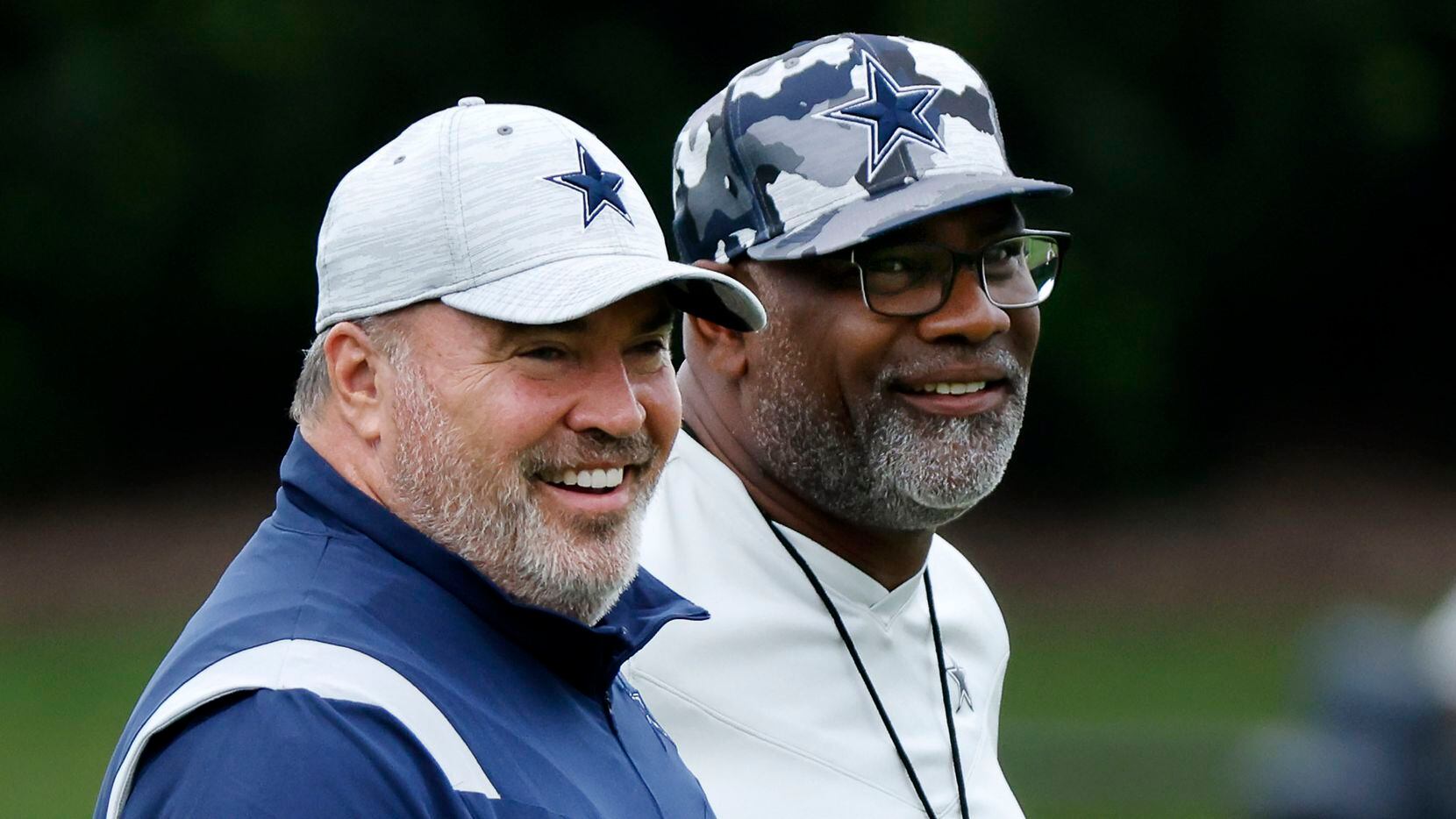 Dallas Cowboys head coach Mike McCarthy (left) and assistant head coach Rob Davis watch...
