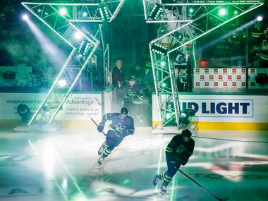 The Dallas Stars take the ice before the first period of an NHL hockey game against the New...