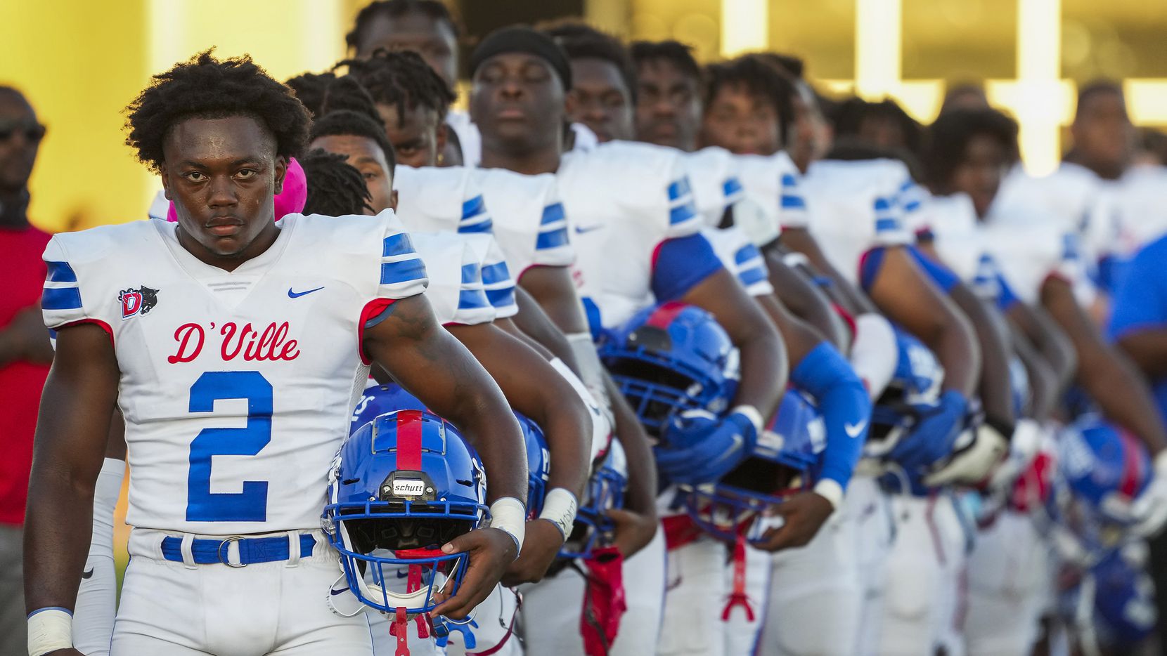 Duncanville linebacker Jordan Crook (2) stands with teammates for the national anthem before a high school football game against Mater Dei on Friday, Aug. 27, 2021, in Duncanville. (Smiley N. Pool/The Dallas Morning News)