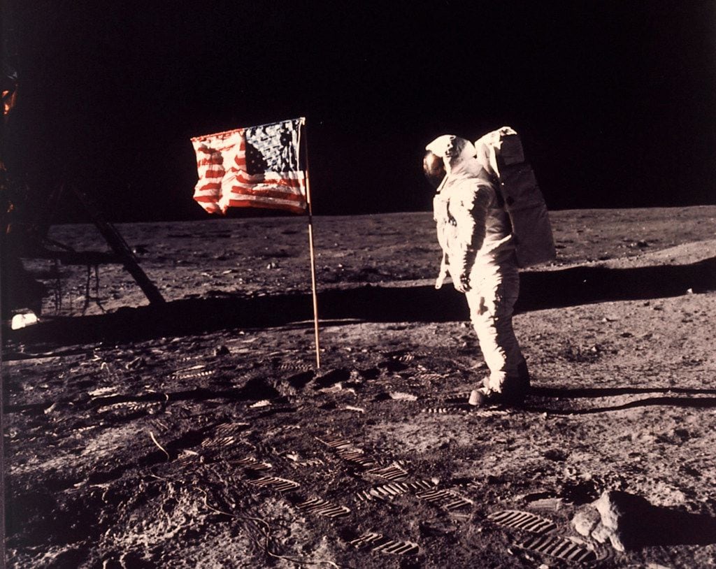 In this image provided by NASA, astronaut Buzz Aldrin poses for a photograph beside the U.S....
