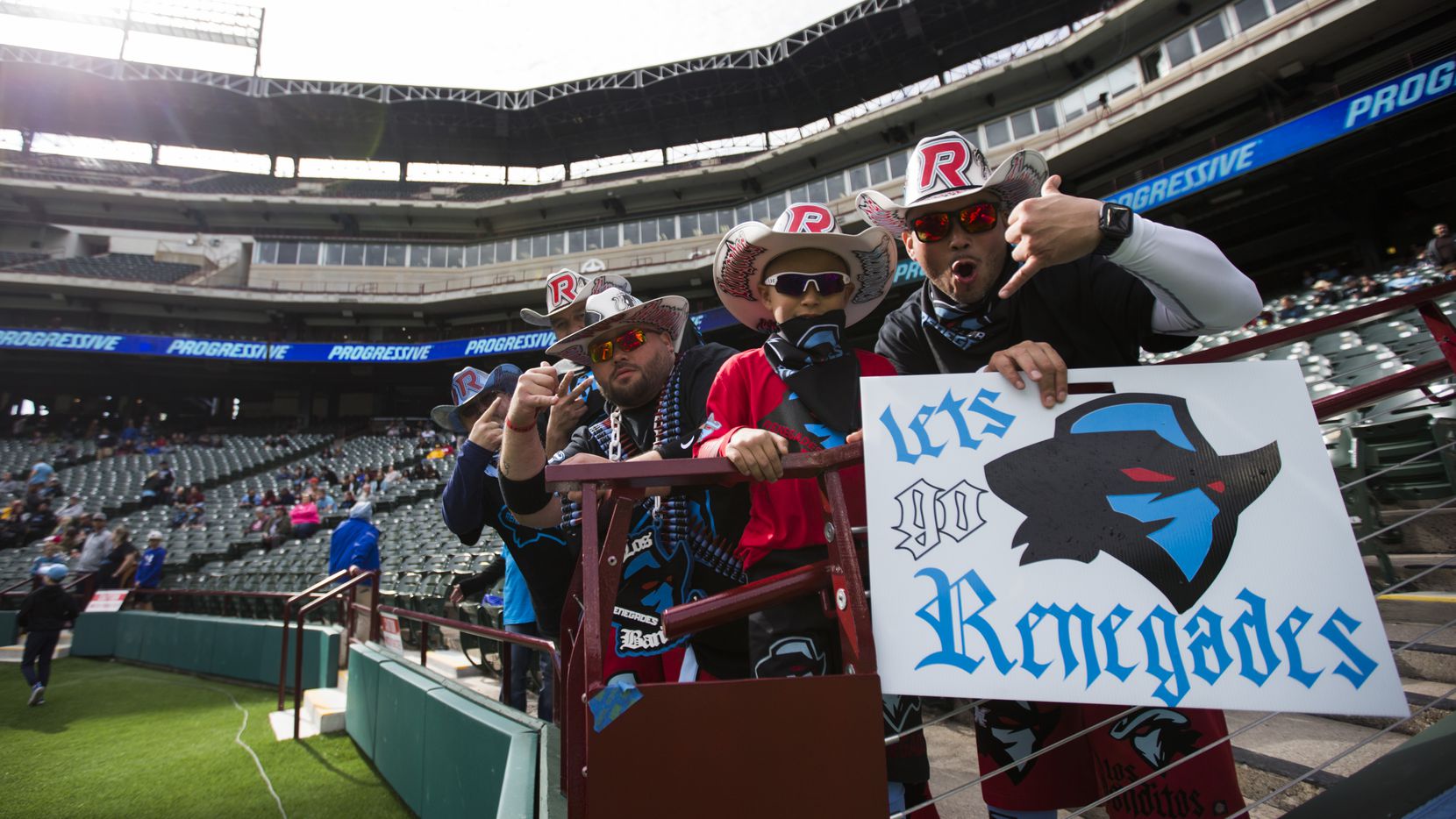 Dallas Renegades fans cheer as the team warms up before an XFL game between...