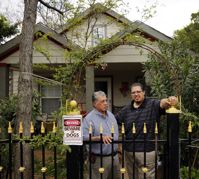 West Dallas homeowner Raul Reyes Sr (left) and his son Raul Reyes Jr pose for a photo in...