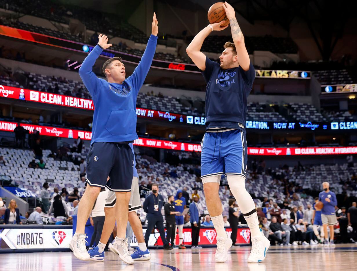 Dallas Mavericks guard Luka Doncic (right) warms up with shooting coach Peter Patton before...