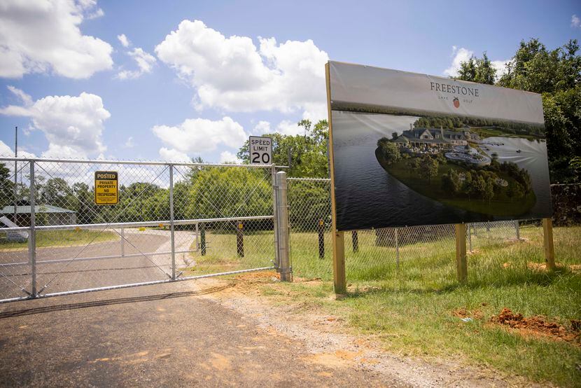 A sign for the Freestone Club development at the gate of the former Fairfield Lake State...