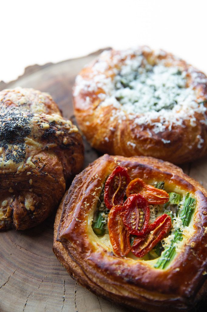 A ham and Gruyere croissant, an asparagus and tomato Danish with roasted garlic-pecorino bechamel, and a roasted mushroom and goat cheese Danish with kale pesto — all cooked by Matt Bresnan.