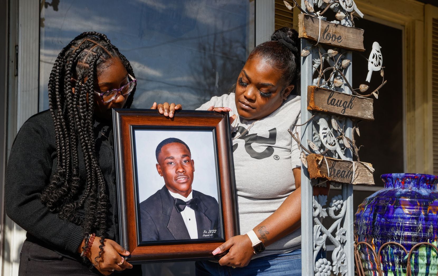 Anthony “Woody” Wilson’s sister Daminica Greer (left), 12, and  mother Dominique Wilson, 37,...
