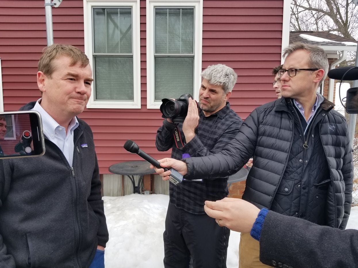 Sen. Michael Bennet of Colorado speaks with reporters in Polk City, Iowa., after meeting with farmers on Feb. 23., 2019, as he weighs a bid for the Democratic presidential nomination.