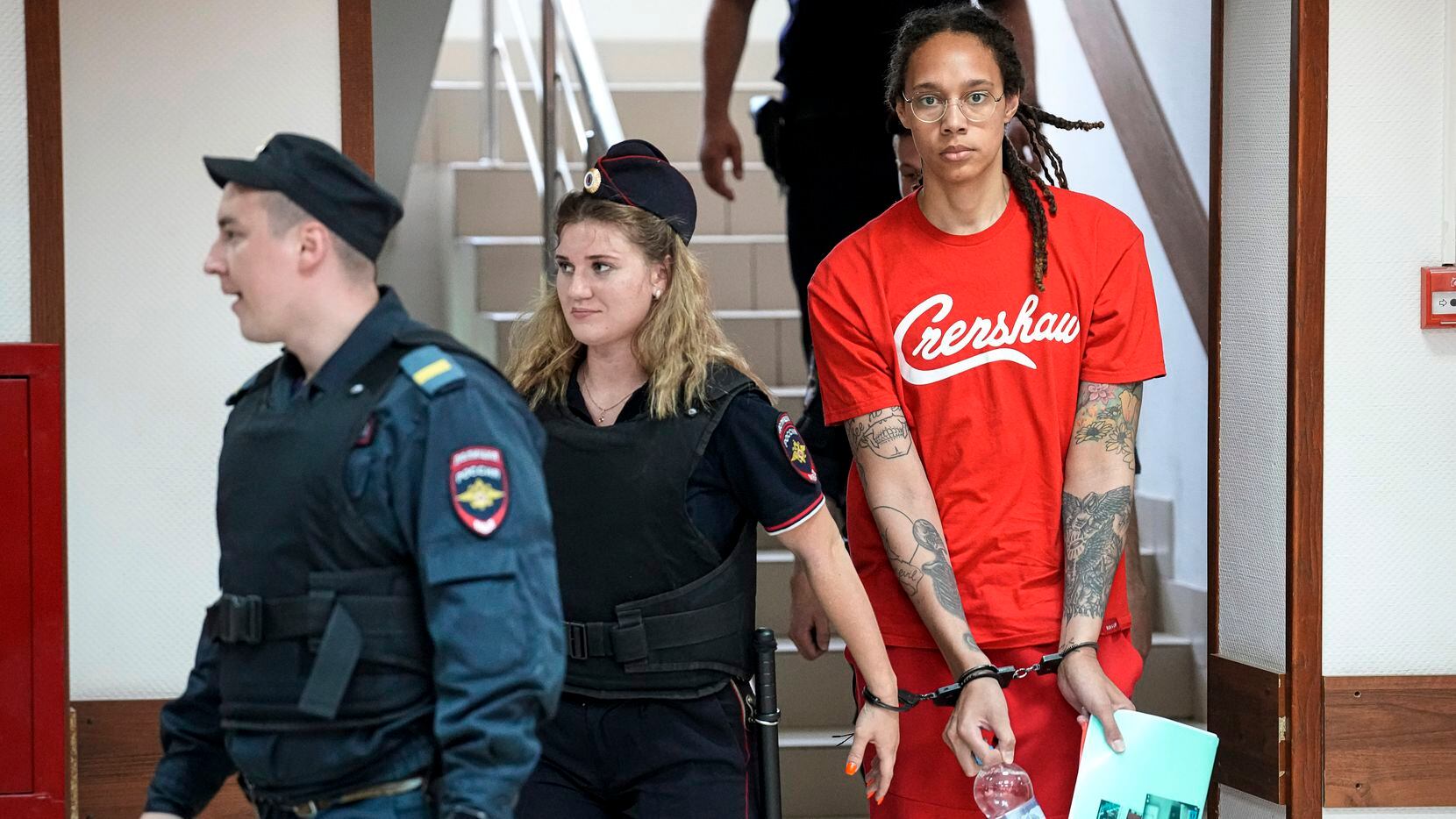 WNBA star and two-time Olympic gold medalist Brittney Griner is escorted to a courtroom for...