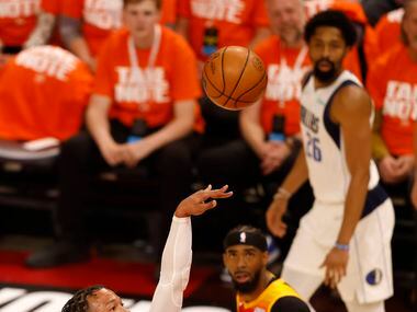 Dallas Mavericks guard Jalen Brunson (13) shoots over Utah Jazz guard Donovan Mitchell (45)...