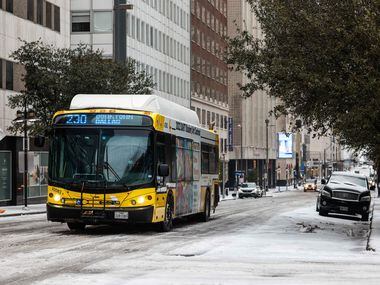 Traffic in downtown Dallas as sleet covered Commerce St on Tuesday, Jan. 31, 2023. Weather...