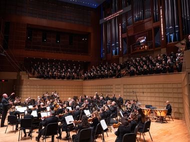 Guest conductor Paul McCreesh (far left) conducts the Dallas Symphony Orchestra and Dallas...